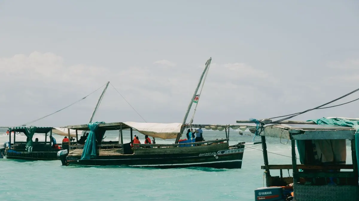 Traditional boats moored in turquoise water on the Kenyan coast
